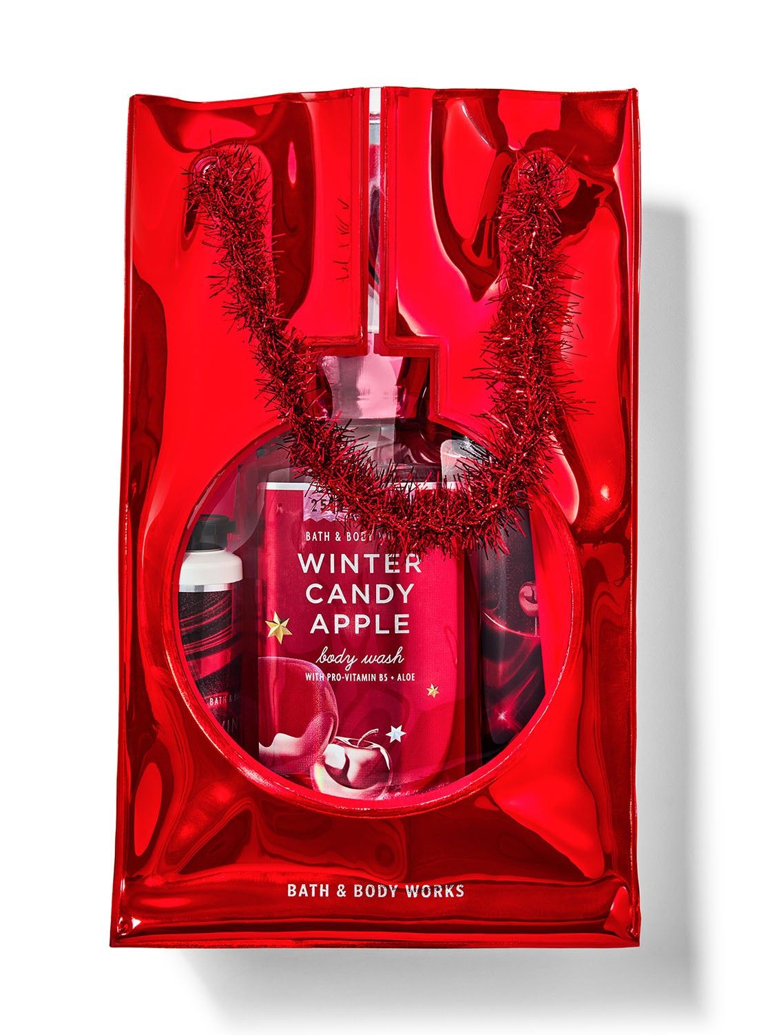 Zestaw "Winter Candy Apple" w czerwonej torbie. Widoczny żel pod prysznic z gwiazdkami i jabłkiem. Bath & Body Works.